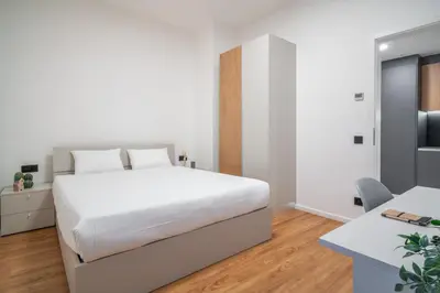 a kitchen with white walls and a white hallway at City Pop 2Night Prague - Self check-in in Prague