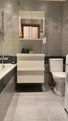 a bathroom with a washing machine and a toilet at Apartmán v centru Prahy in Prague