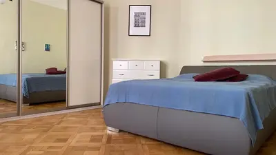 a bedroom with a bed and a dresser at Apartmán v centru Prahy in Prague
