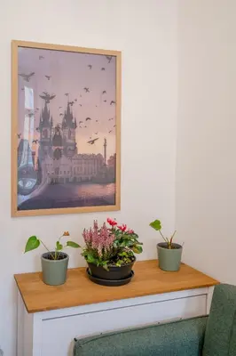 a kitchen with green cabinets and a sink at Seifertova Apartments by Willstay in Prague