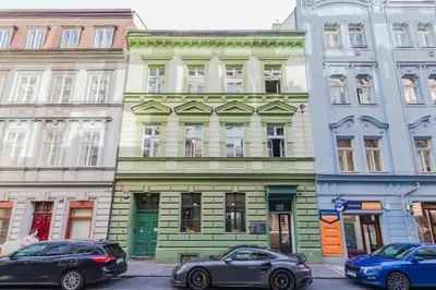 a group of buildings on a city street at LOFT Apartments in Prague