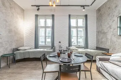 a living room with a table and a couch at LOFT Apartments in Prague