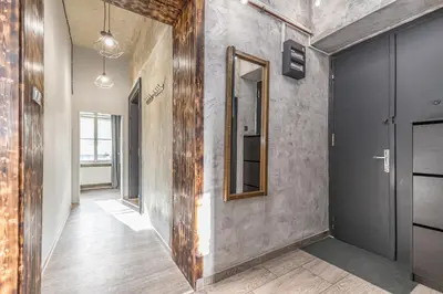 a hallway with a mirror on the wall at LOFT Apartments in Prague