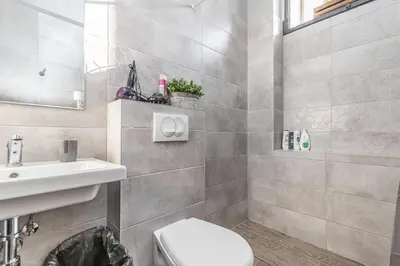 a bathroom with a toilet and a sink at LOFT Apartments in Prague
