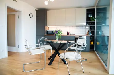 a kitchen with a table and chairs in a room at Residence 60 free parking&wifi in Prague