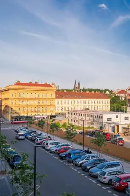 a parking lot with cars parked in front of a building at Residence 60 free parking&wifi in Prague