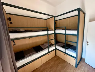 a room with three bunk beds in a room at Onefam Arbes in Prague