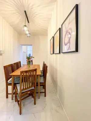 a dining room with a wooden table and chairs at Powder Tower Residence in Prague