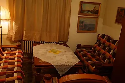 a living room with a table and two chairs at Apartment Trojska in Prague