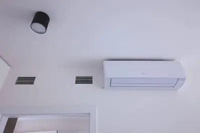 a room with a ceiling fan and a light at Spacious Top Floor Flat, Air Conditioning, Free Parking, 200Mb WiFi in Prague