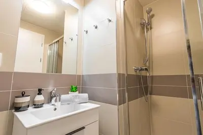 a bathroom with a sink and a shower at On-site Free Parking, 12 to min Centre, Supermarket in Prague
