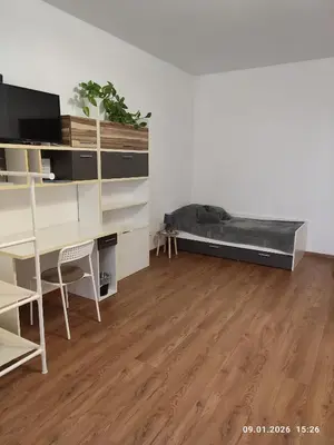 a room with two beds and a couch at Villa Homestay Nad Helmrovkou in Prague