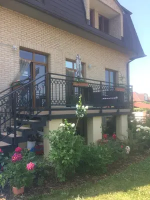 a bathroom with a toilet and a sink and a shower at Villa Homestay Nad Helmrovkou in Prague