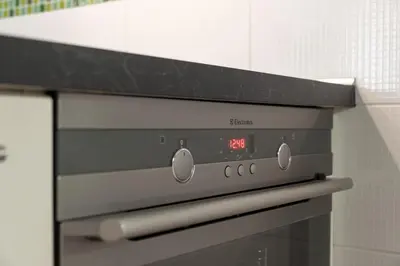 an oven with a clock on it in a kitchen at Peace and Comfort Near Center with Balcony, 500MB WIFI in Prague