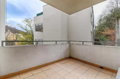 an empty balcony with a view of a building at Peace and Comfort Near Center with Balcony, 500MB WIFI in Prague