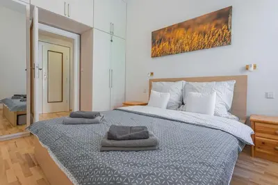 a bedroom with a large bed with two towels on it at Josef Manes birth house, All Sights Walkable, Old Town Square in Prague