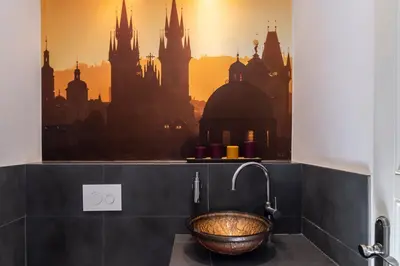 a bathroom with a window with a view of a city at Royal Residence Vysehrad Prague in Prague