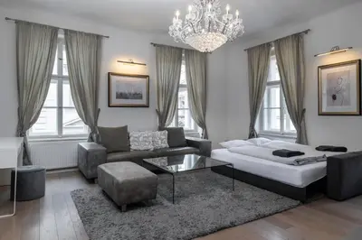 a living room with a couch and a coffee table at Royal Residence Vysehrad Prague in Prague