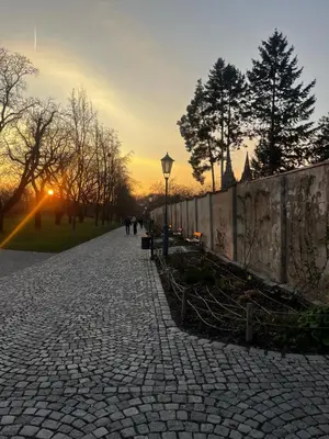 a cobblestone street in a park with a street light at Royal Residence Vysehrad Prague in Prague