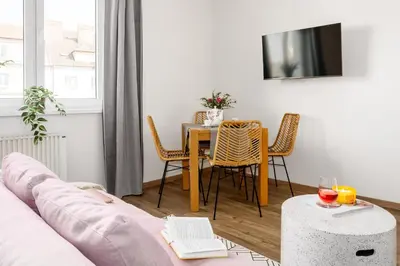 a living room with a couch and a table at Prague Days - Open-plan Studio Near Vyšehrad Castle in Prague