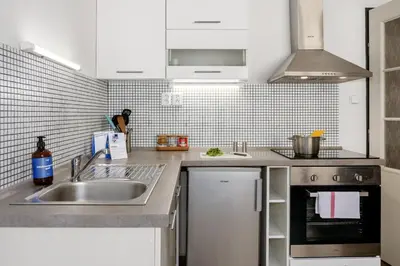 a kitchen with a sink and a stove at Prague Days - Open-plan Studio Near Vyšehrad Castle in Prague