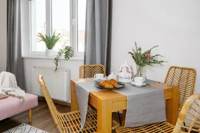 a dining room with a table with a bowl of fruit on it at Prague Days - Open-plan Studio Near Vyšehrad Castle in Prague