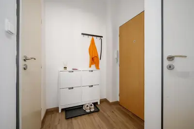 a room with a white cabinet and a door at Prague Days - Open-plan Studio Near Vyšehrad Castle in Prague
