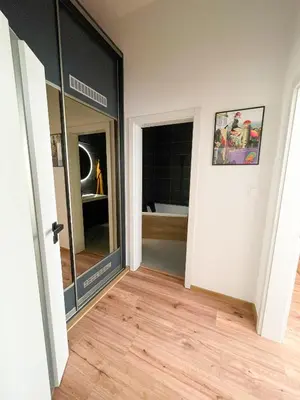a room with a glass door and a wooden floor at Vantisch Old Town Apartment in Prague