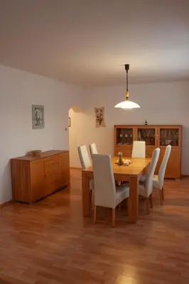 a room with aoyer with a wooden floor at Apartmán se společným bazénem Zlonice in Zlonice