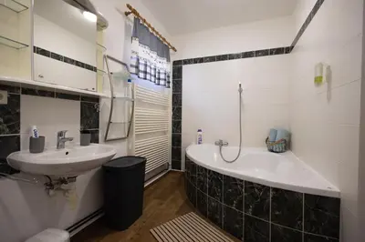 a small bathroom with a sink and a counter at U Čertovy brázdy in Sázava
