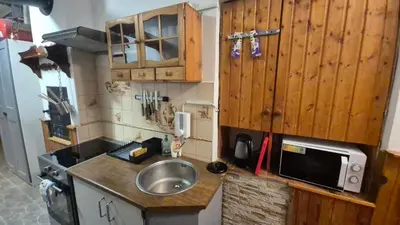 a living room with a table and a living room with a couch at U Čertovy brázdy in Sázava