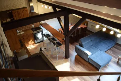 an overhead view of a living room with a blue couch at Đã Về - Đã Tới in Prague