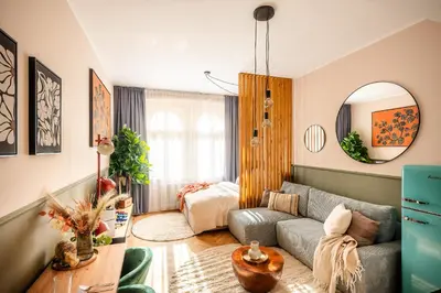a living room with a couch and a table at Accordion Boutique Hotel & Premium Suites in Prague