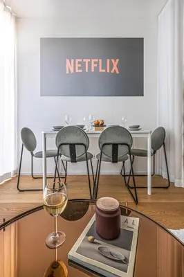 a table with two chairs and a table with a wine glass at Prague Days - Studio Apartment with Garage Parking and Balcony in Prague
