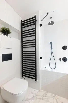 a white bathroom with a toilet and a shower at Prague Days - Studio Apartment with Garage Parking and Balcony in Prague