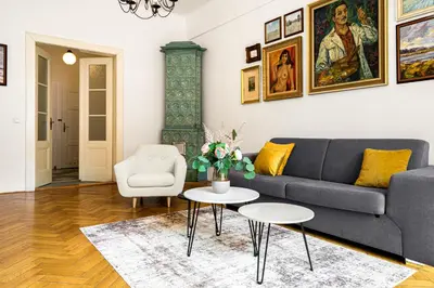 a living room with a couch and a table at Prague Days - One-bedroom Apartment with Workspace in the Old Town in Prague