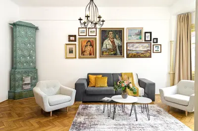 a living room with a couch and two chairs and a table at Prague Days - One-bedroom Apartment with Workspace in the Old Town in Prague