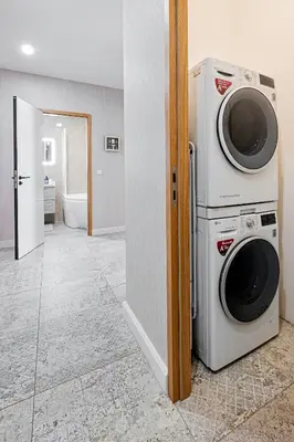 a washing machine and a dryer in a room at Prague Days - Apartment with 2 Bedrooms and 2 Balconies in Vinohrady in Prague