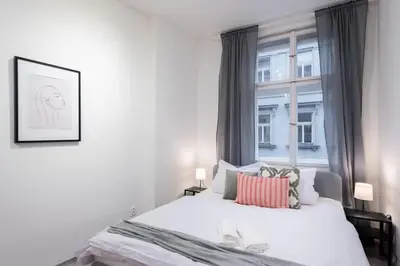 a bedroom with a large bed and a window at Timeless Charming Studio near Old Town in Prague