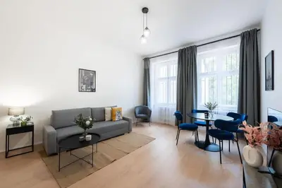 a living room with a couch and a table at Urban 2BR Haven with Sofa Bed in Central Prague in Prague