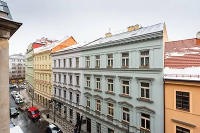 a large white building on a city street at Welcoming Studio in Historic Prague in Prague