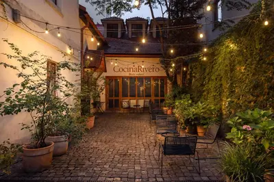 a building with a patio with plants and lights at Metropolitan Prague Apt with Amenities in Prague