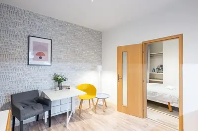 a room with a desk and a bedroom with a bed at Neat Cozy Old Town Retreat w Queen Bed in Prague