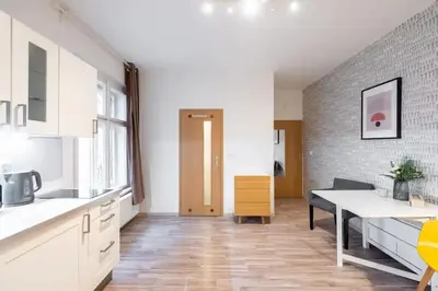 a kitchen with a table and a dining room at Neat Cozy Old Town Retreat w Queen Bed in Prague