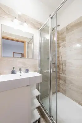 a bathroom with a sink and a shower at Neat Cozy Old Town Retreat w Queen Bed in Prague