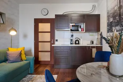 a basket with bottles of water and a blow dryer at High-Sky O2 arena Apartment with garage parking and AC in Prague