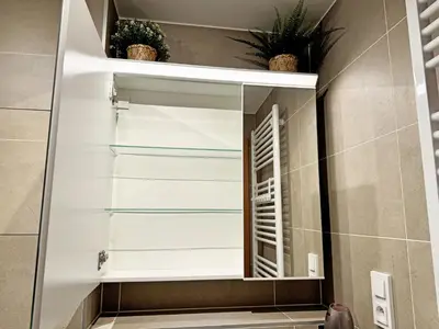 a bathroom with a mirror in a bathroom at New studio, King bed, Free parking, Terrace in Prague