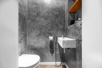 a bathroom with a toilet and a sink at Cozy place with wonderful view in Prague