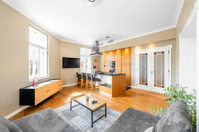 a living room with a couch and a table at Cozy place with wonderful view in Prague