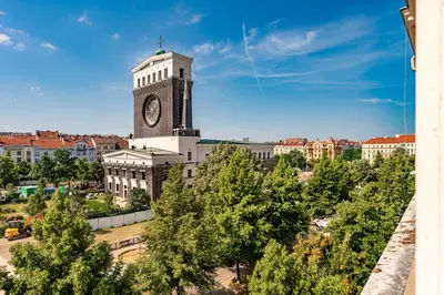 a building with a clock tower on top of it at Cozy place with wonderful view in Prague